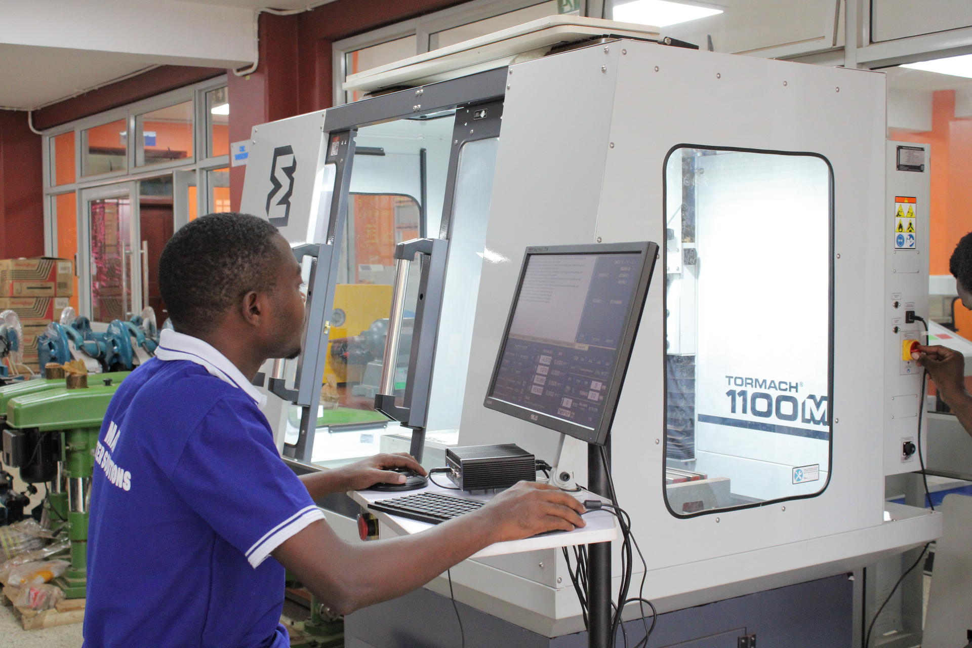 a man standing in front of a computer
