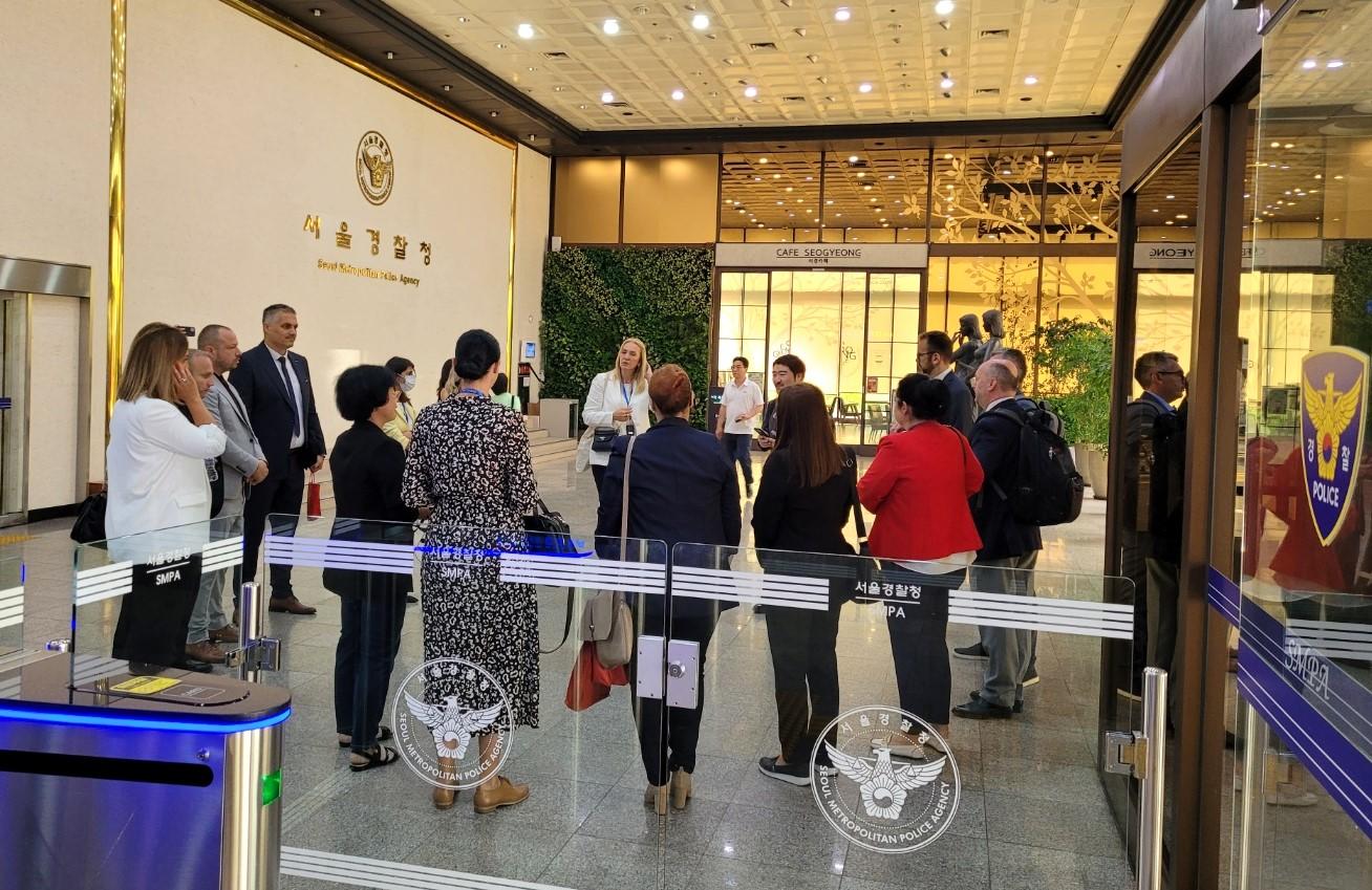 a group of people standing in front of a store