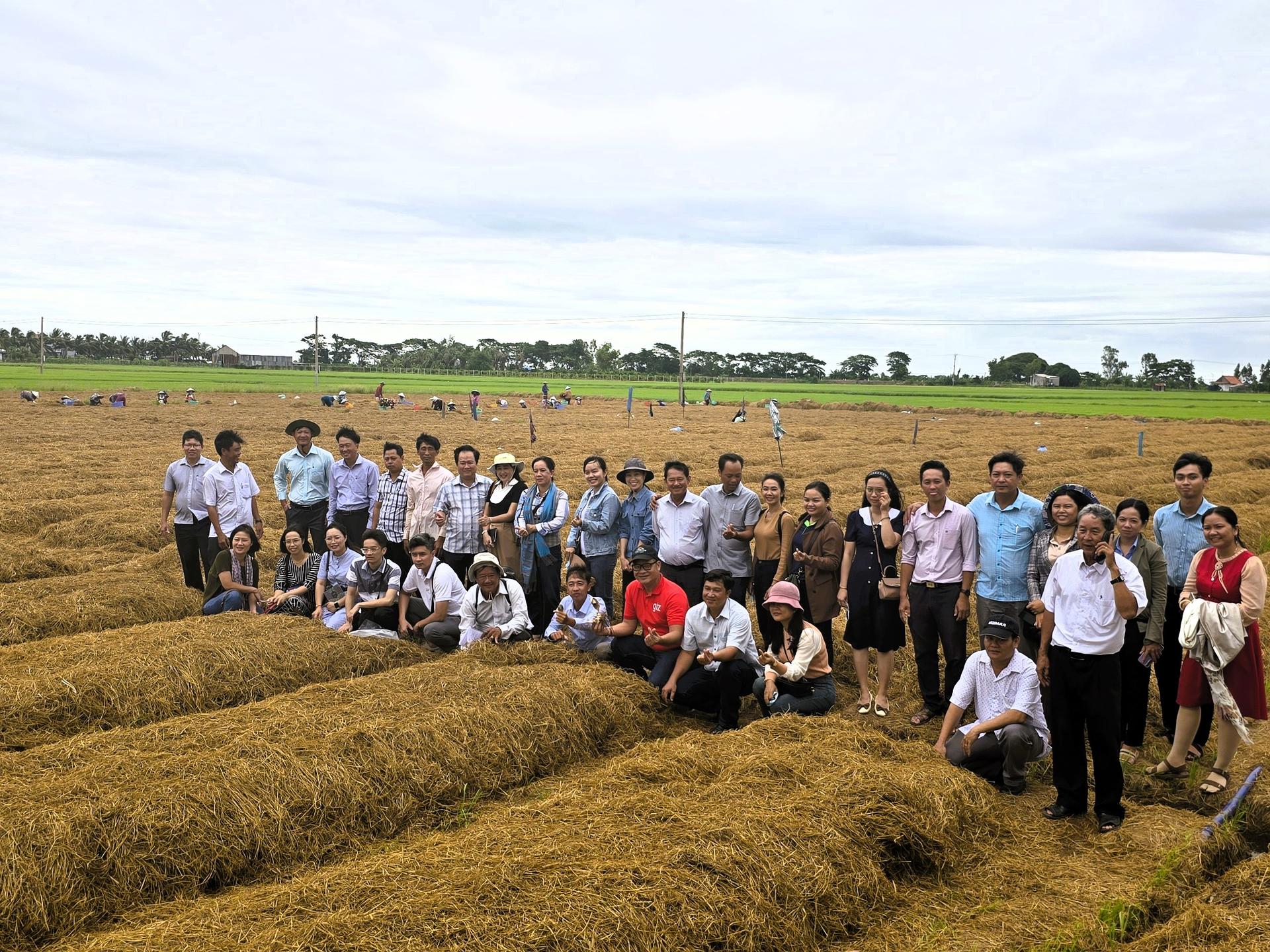 a group of people standing in a field