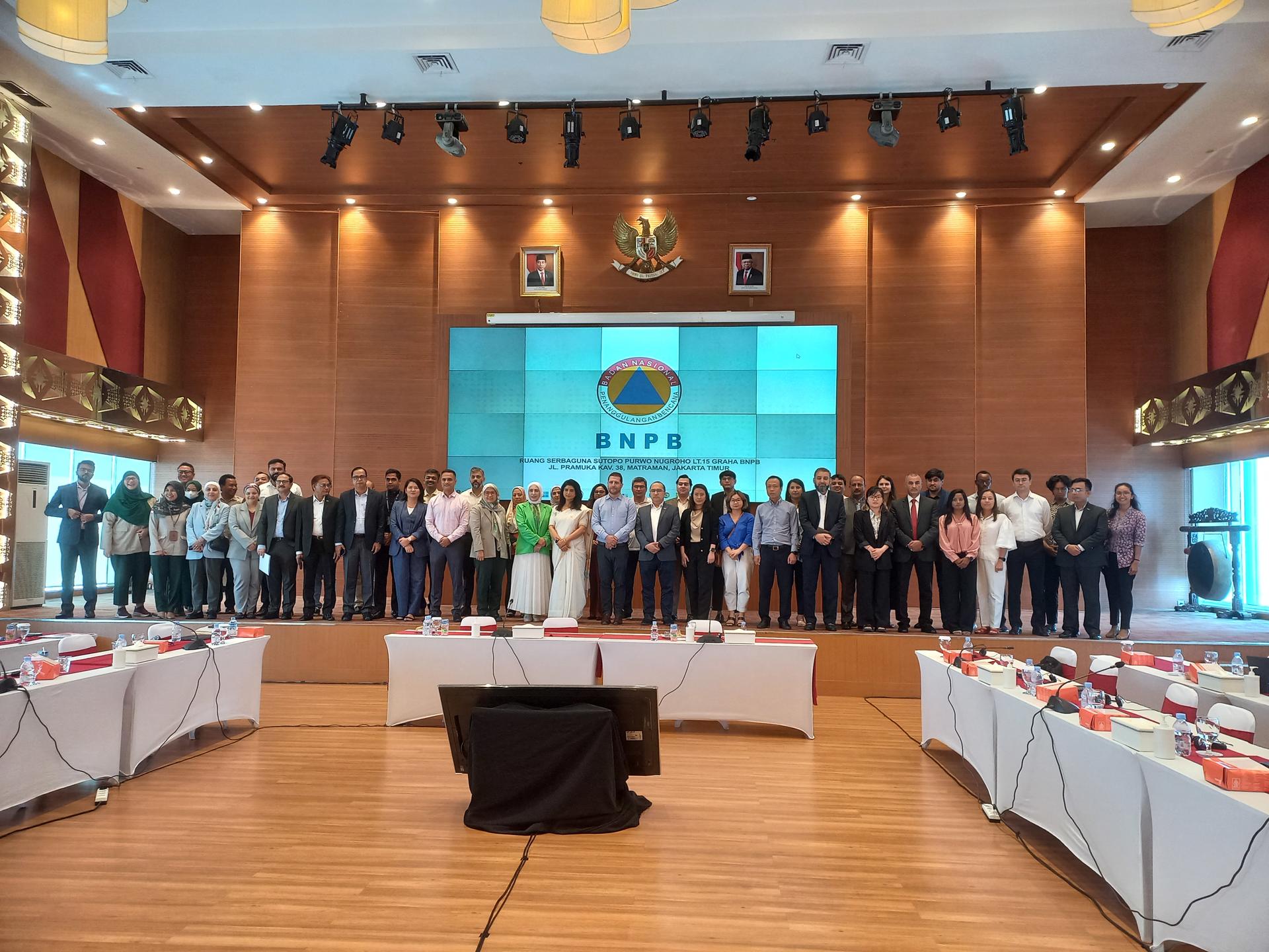 all participants of the event are standing next to each other