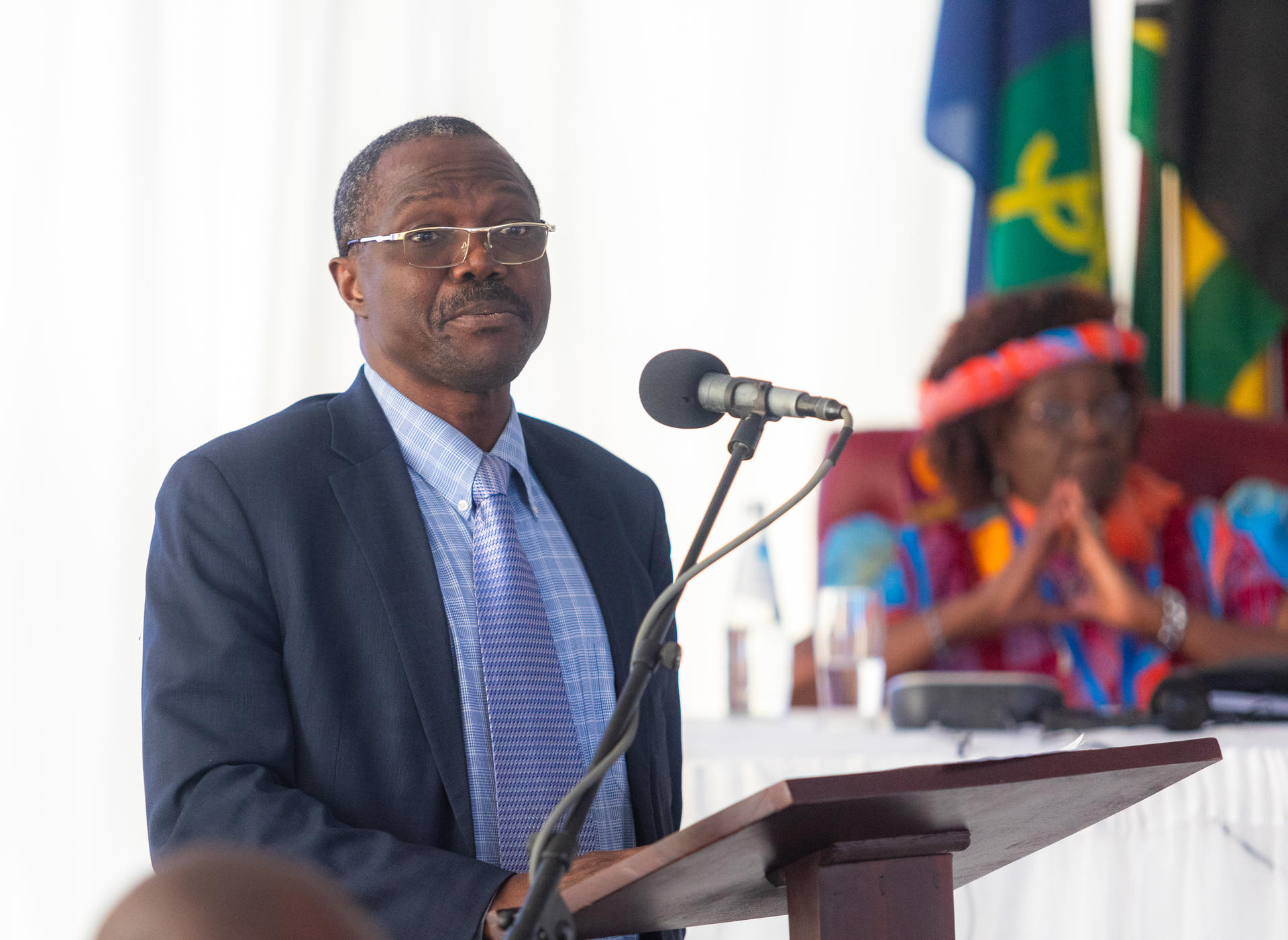 Man making a speech behind a microphone