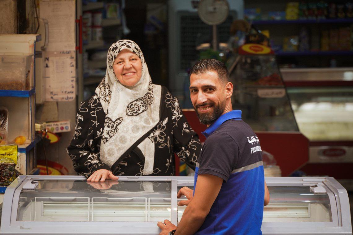 a police officer standing in front of a store