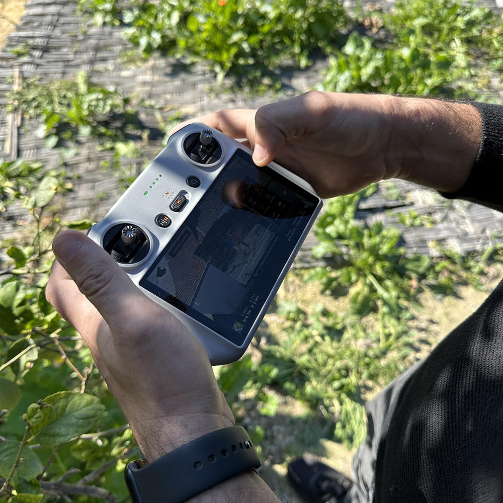 a hand holding a drone operator