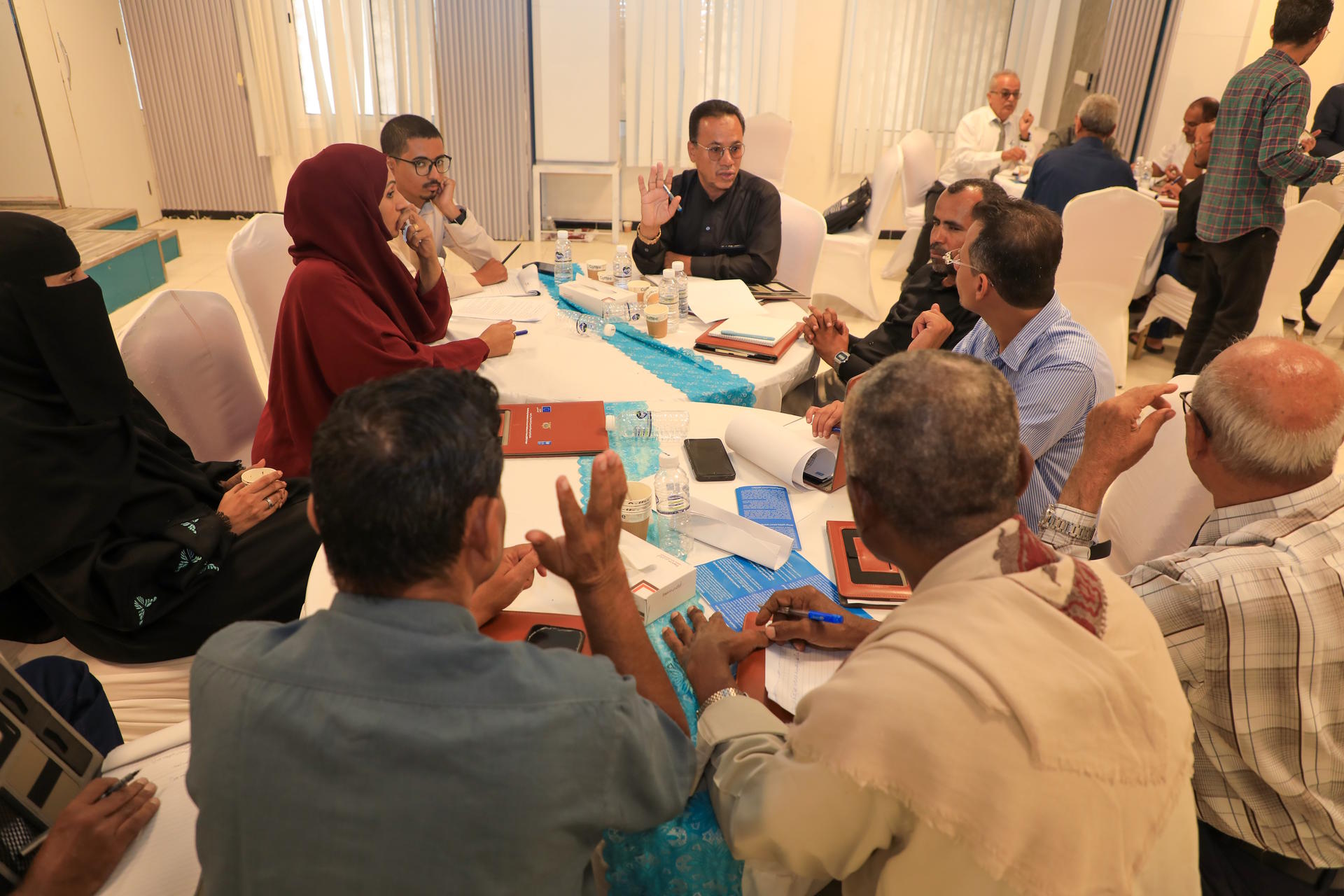 a group of people sitting at a table