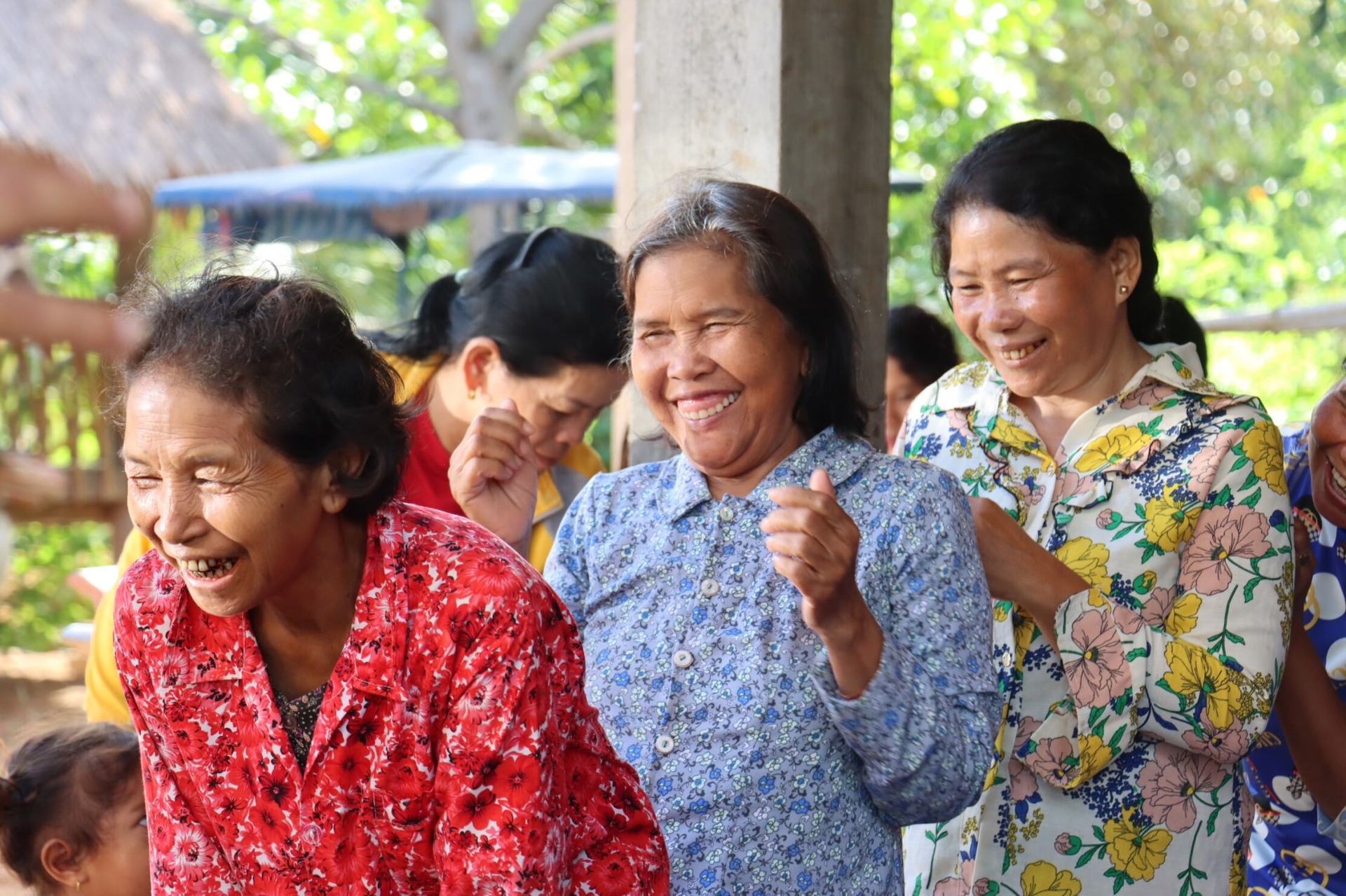 A group of women laughing and smiling