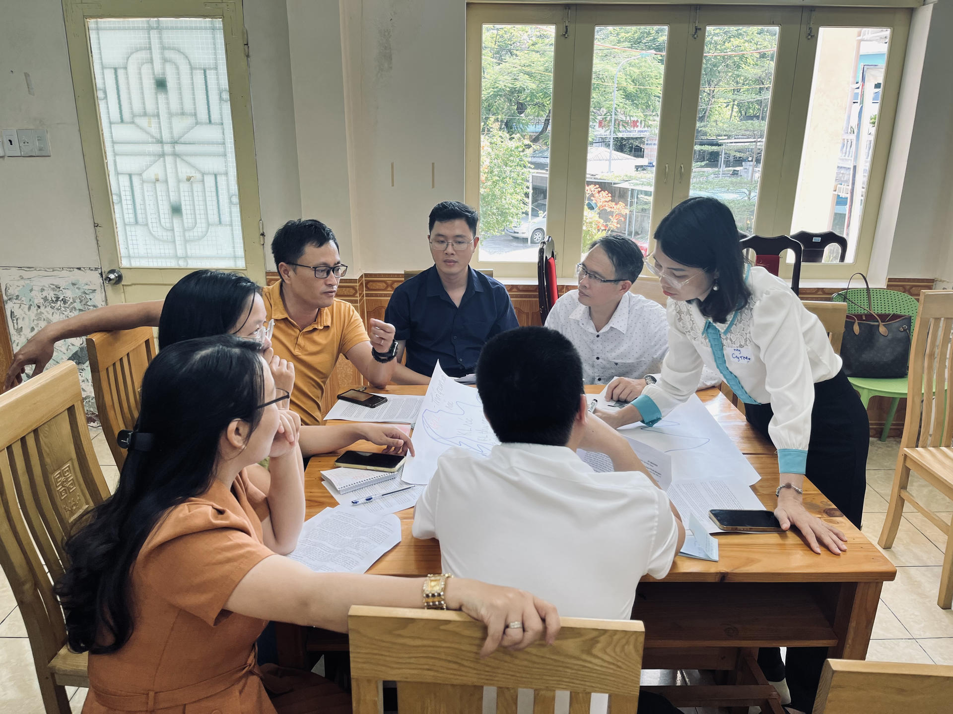 a group of people sitting at a table