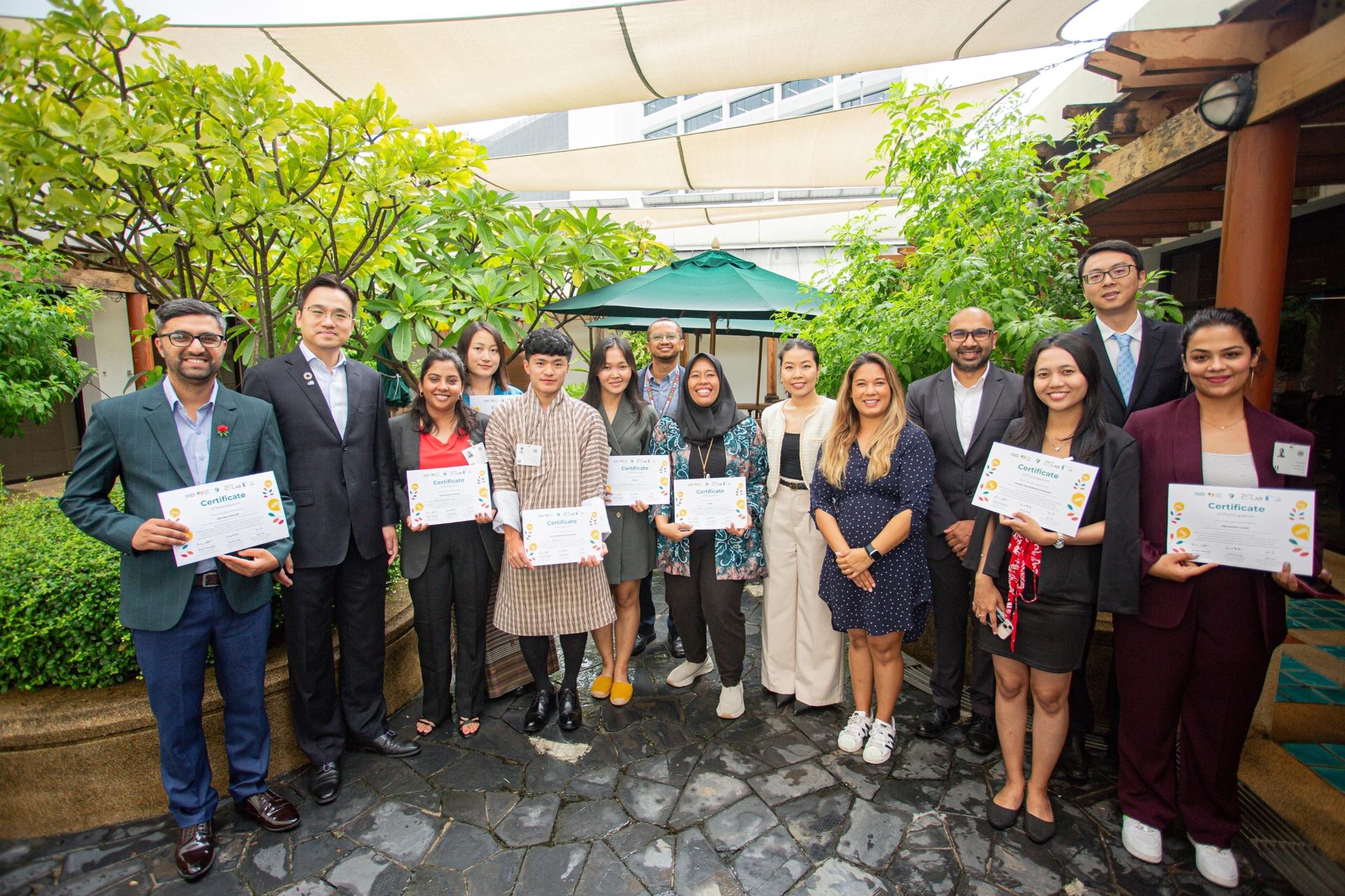 a group of young entrepreneurs and judges posing for a picture 