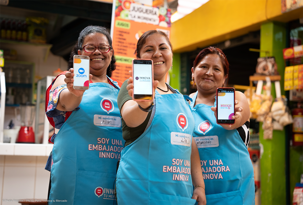 a group of people standing in front of a store