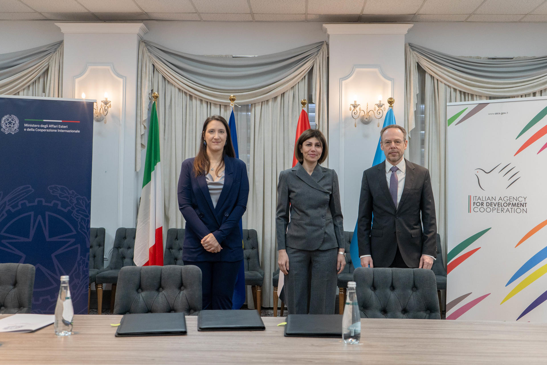 a group of people standing in a room
