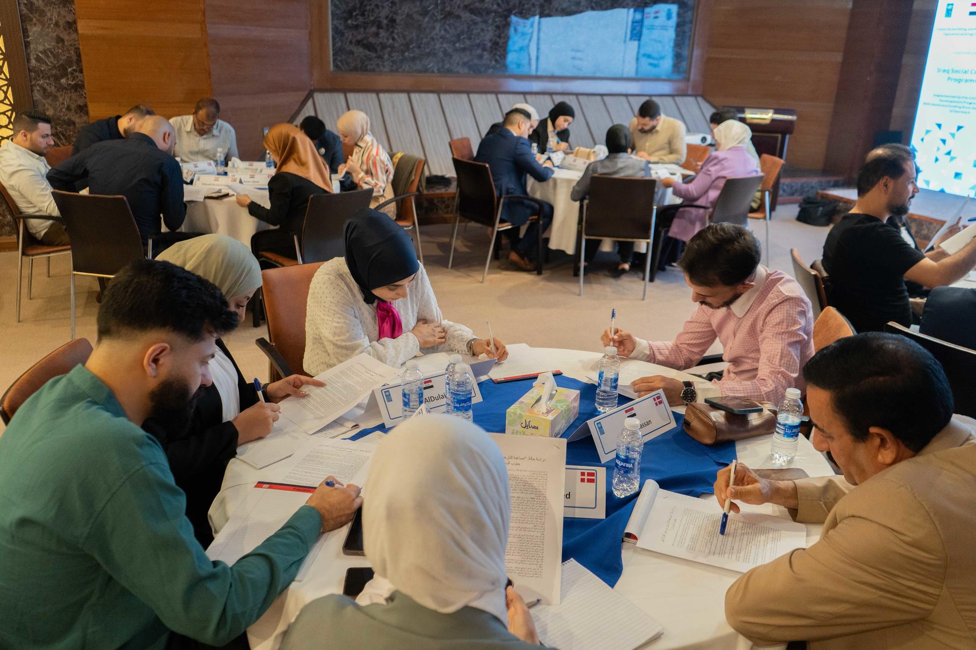 a group of people sitting at a table