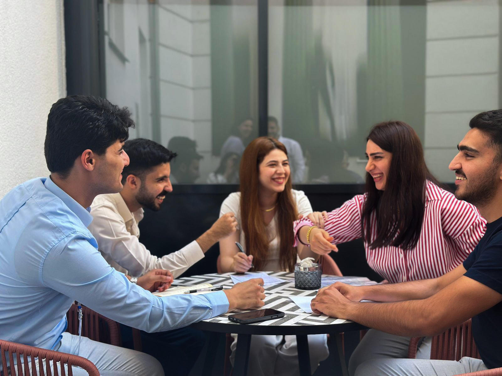 a group of people sitting at a table
