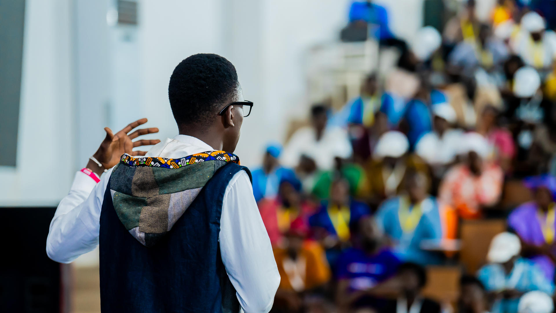 a man standing in front of a crowd
