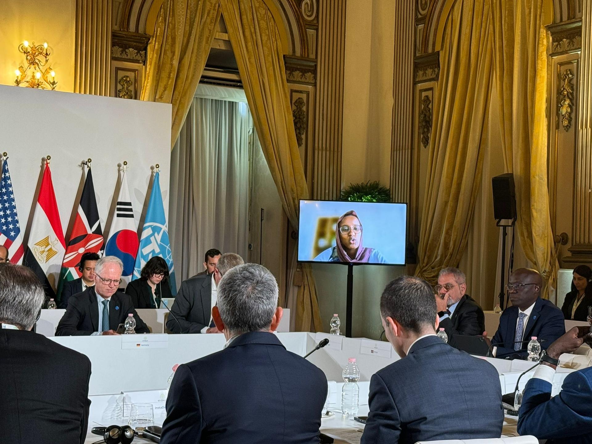 a group of people sitting at a table