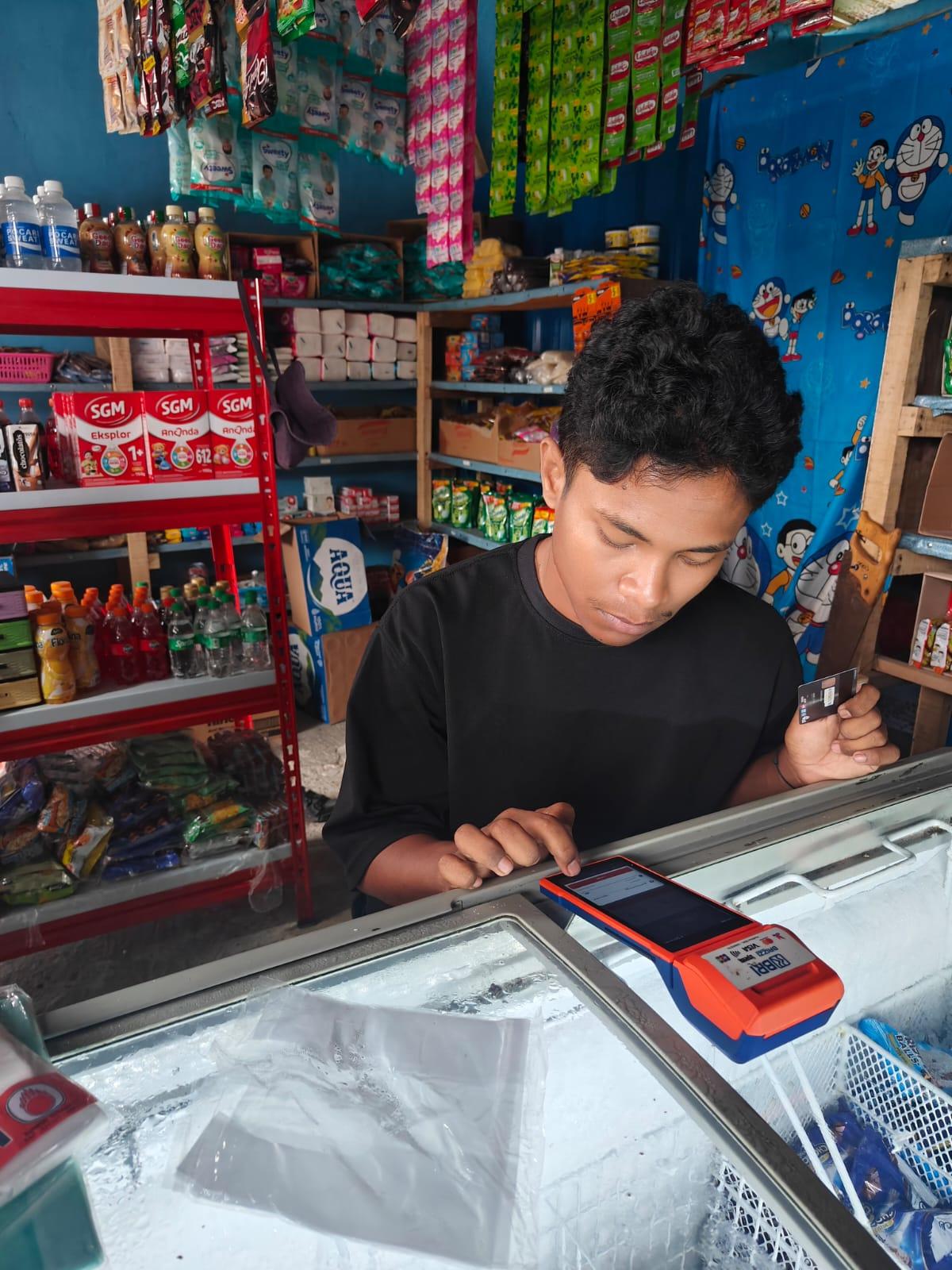 a man sitting in front of a store
