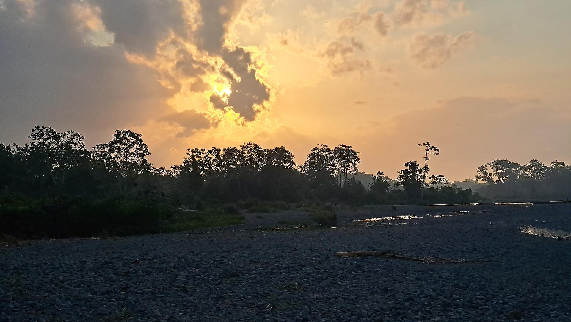 a sunset over a body of water