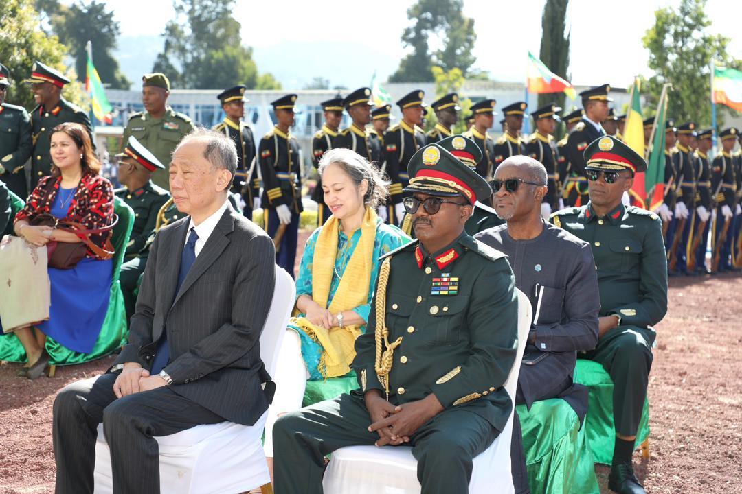 a group of people sitting on a bench