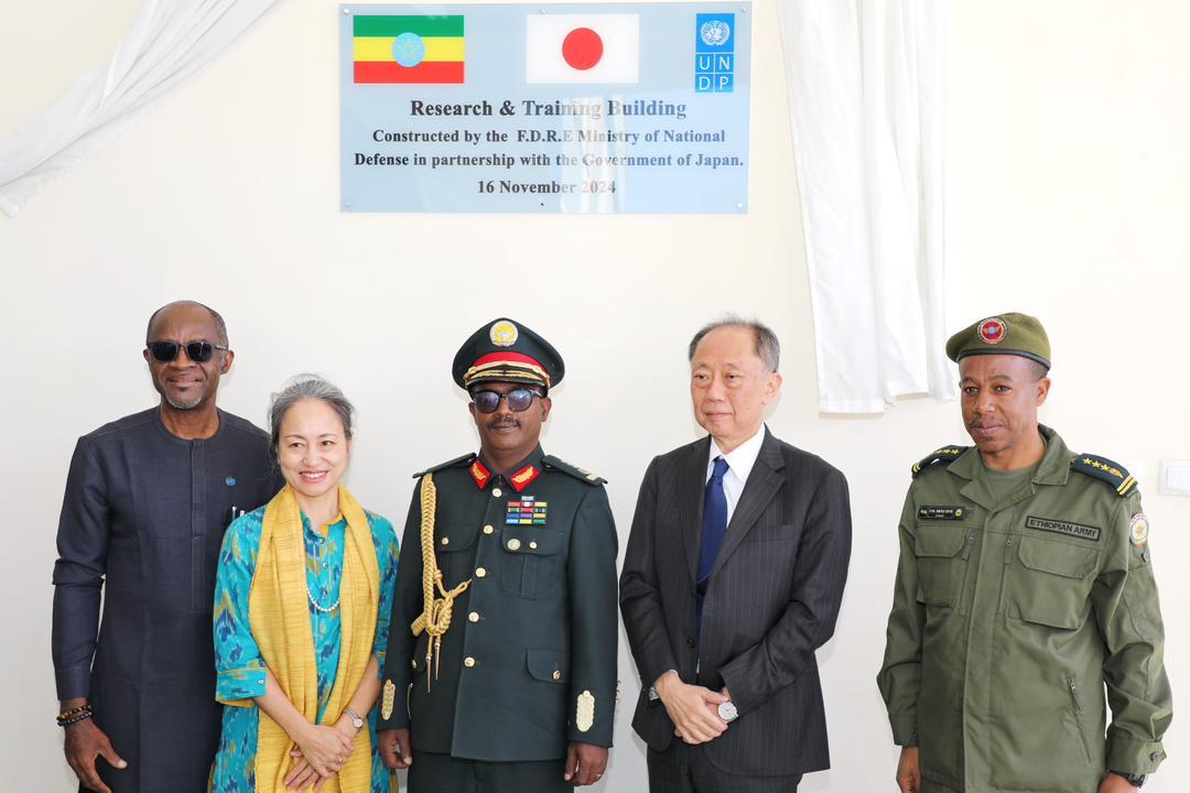 a group of people in uniform posing for a photo