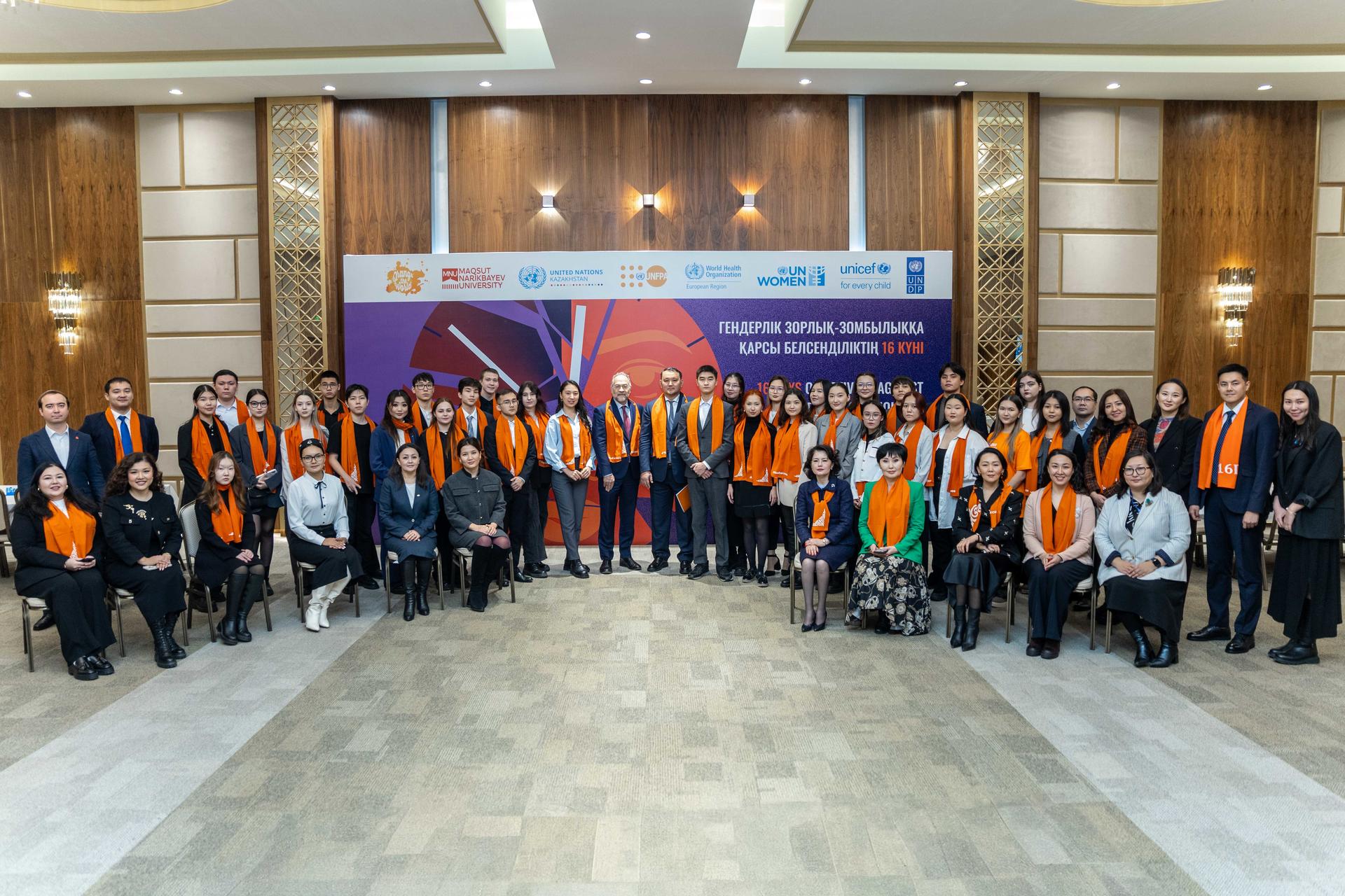 photo of a group of people in front of a banner