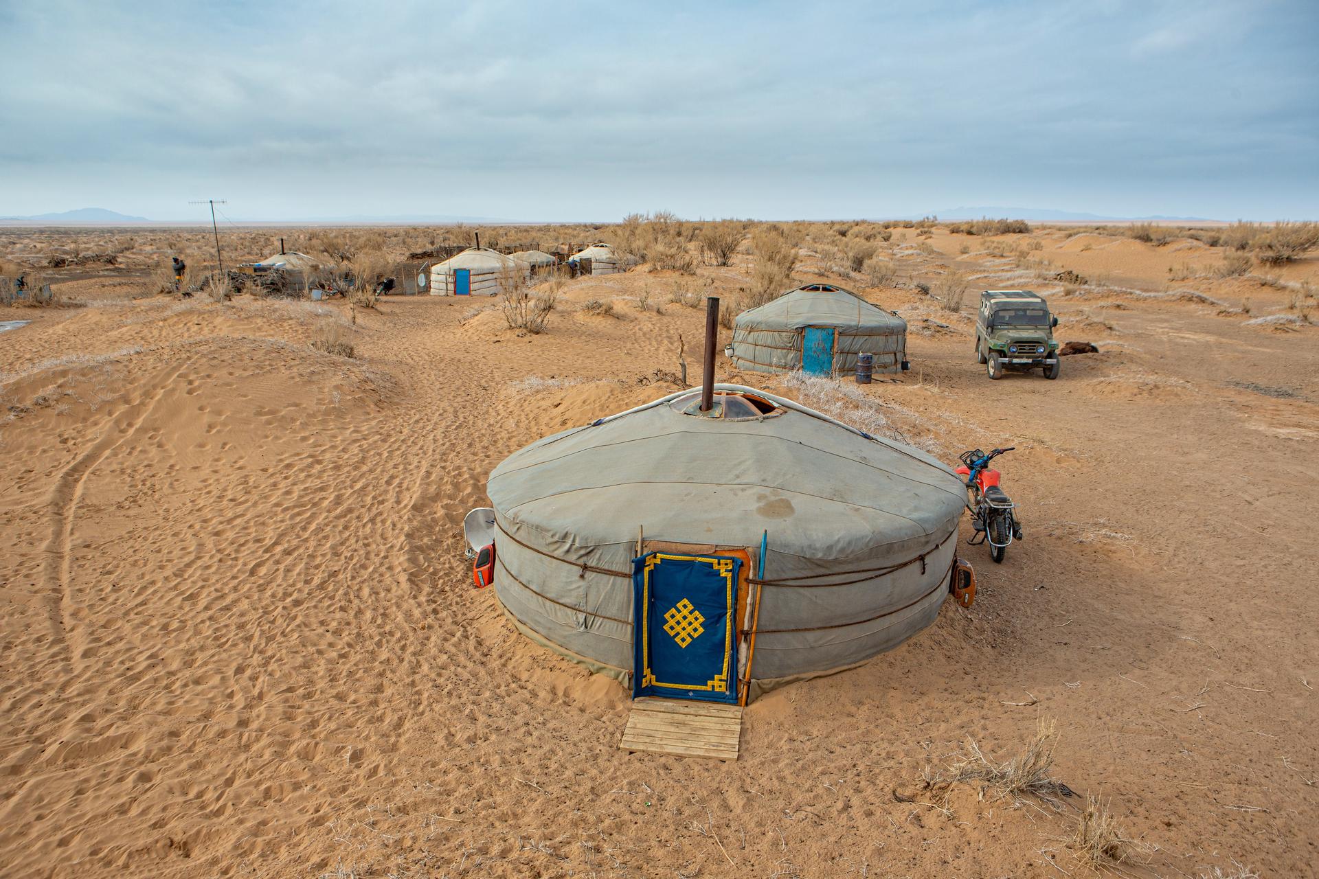 a car parked on a sandy beach