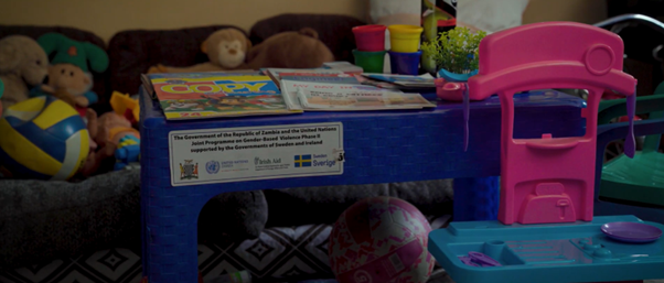 An image of a room with children's tables, chairs, books and toys