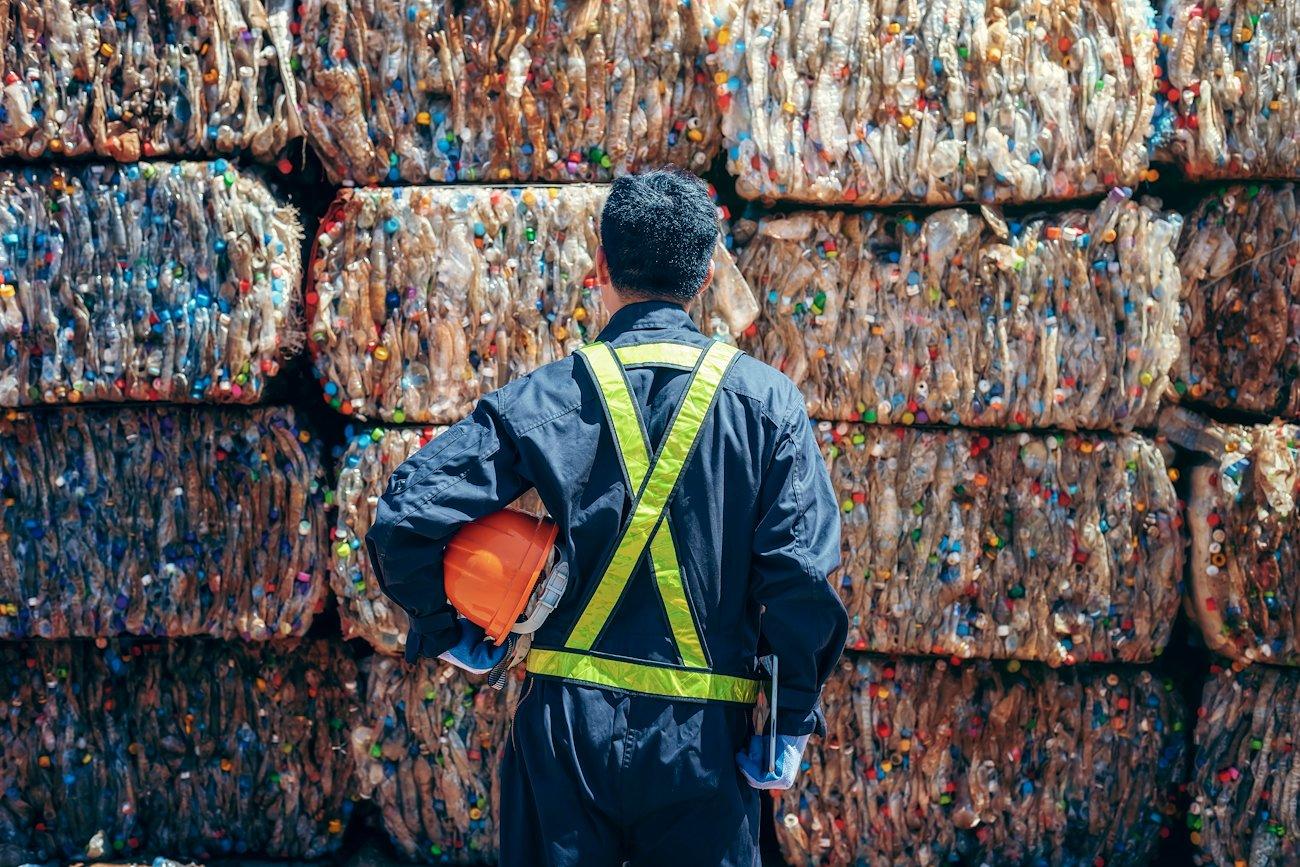 a person standing in front of a colorful wall