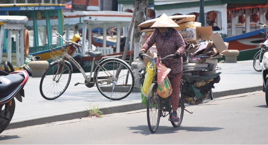 a person riding a bicycle on a city street
