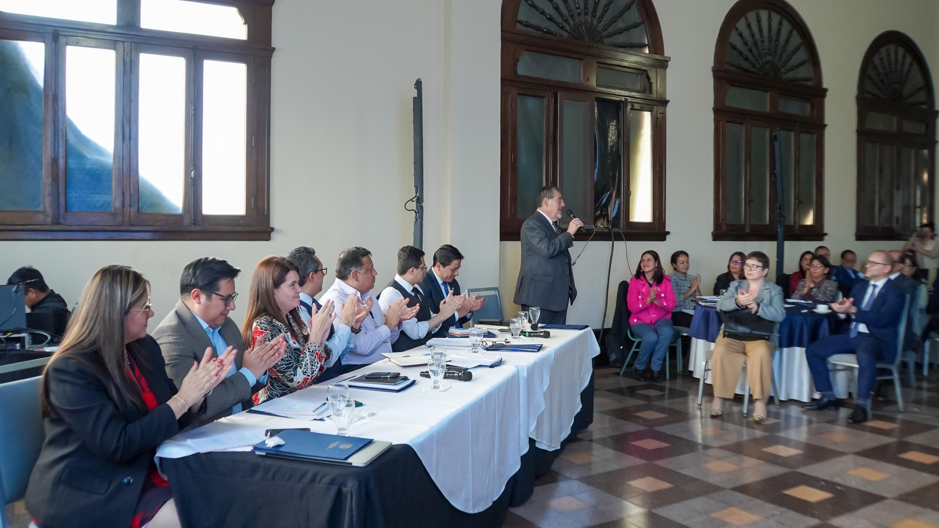 a group of people sitting at a table