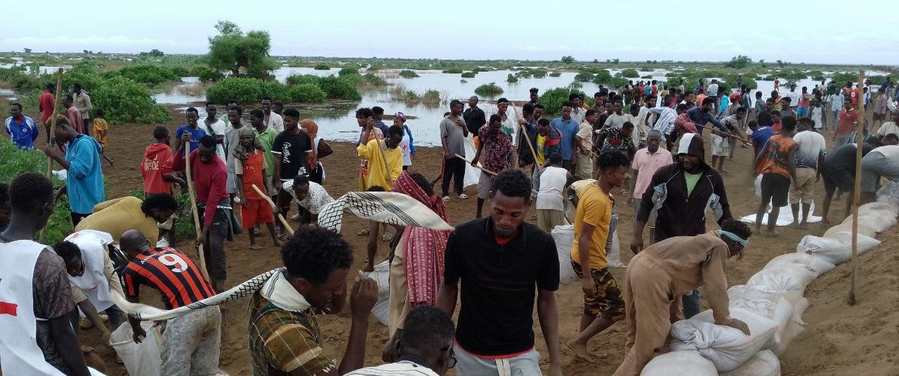 a group of people in a flooded area in Ethiopia