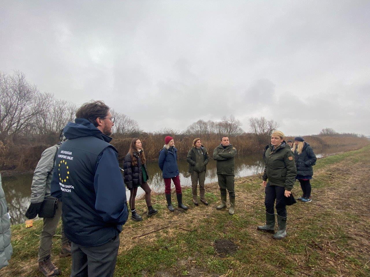 a group of people standing in a field