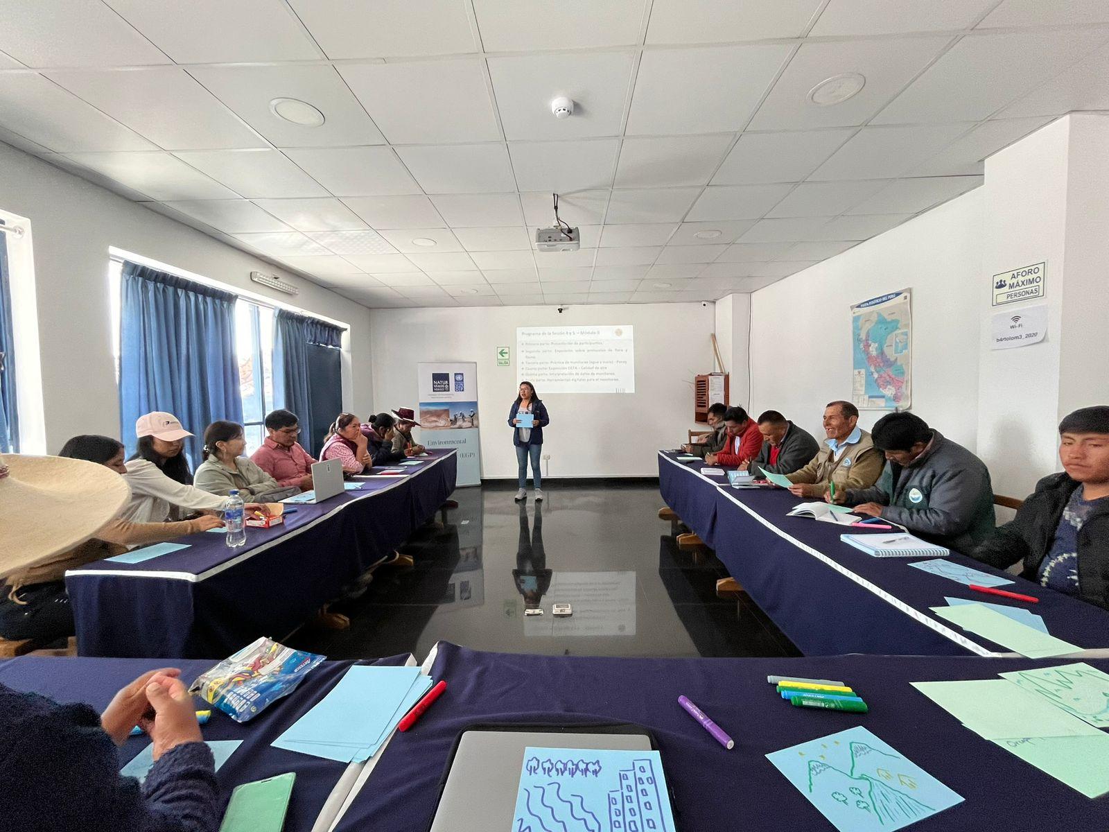 a group of people sitting at a table in a room