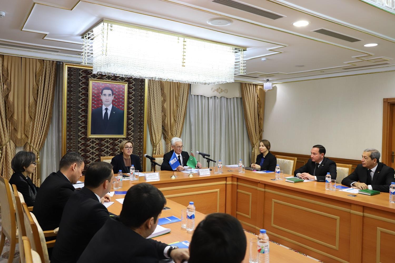 a group of people sitting at a table in a room