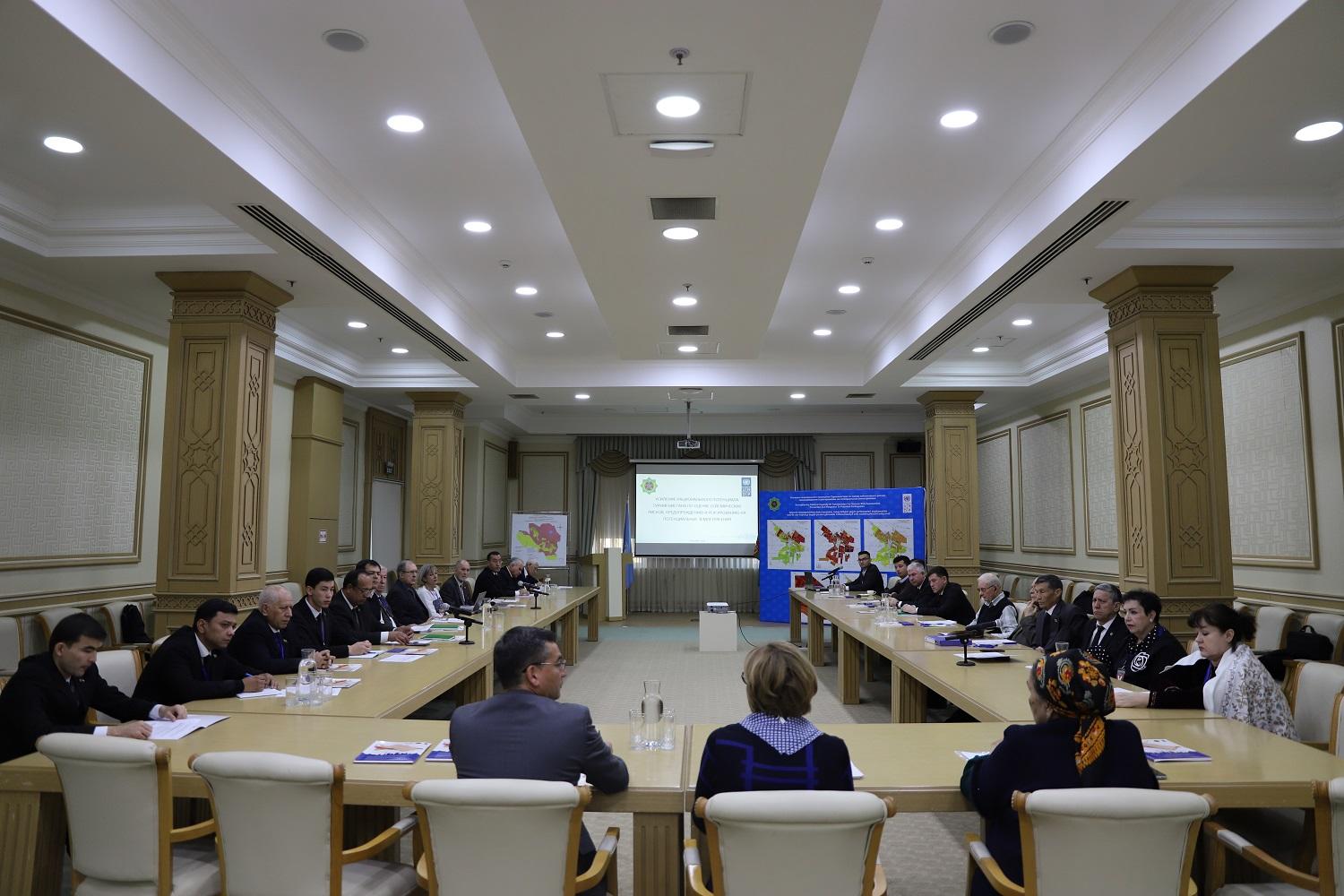 a group of people sitting at a table in a room