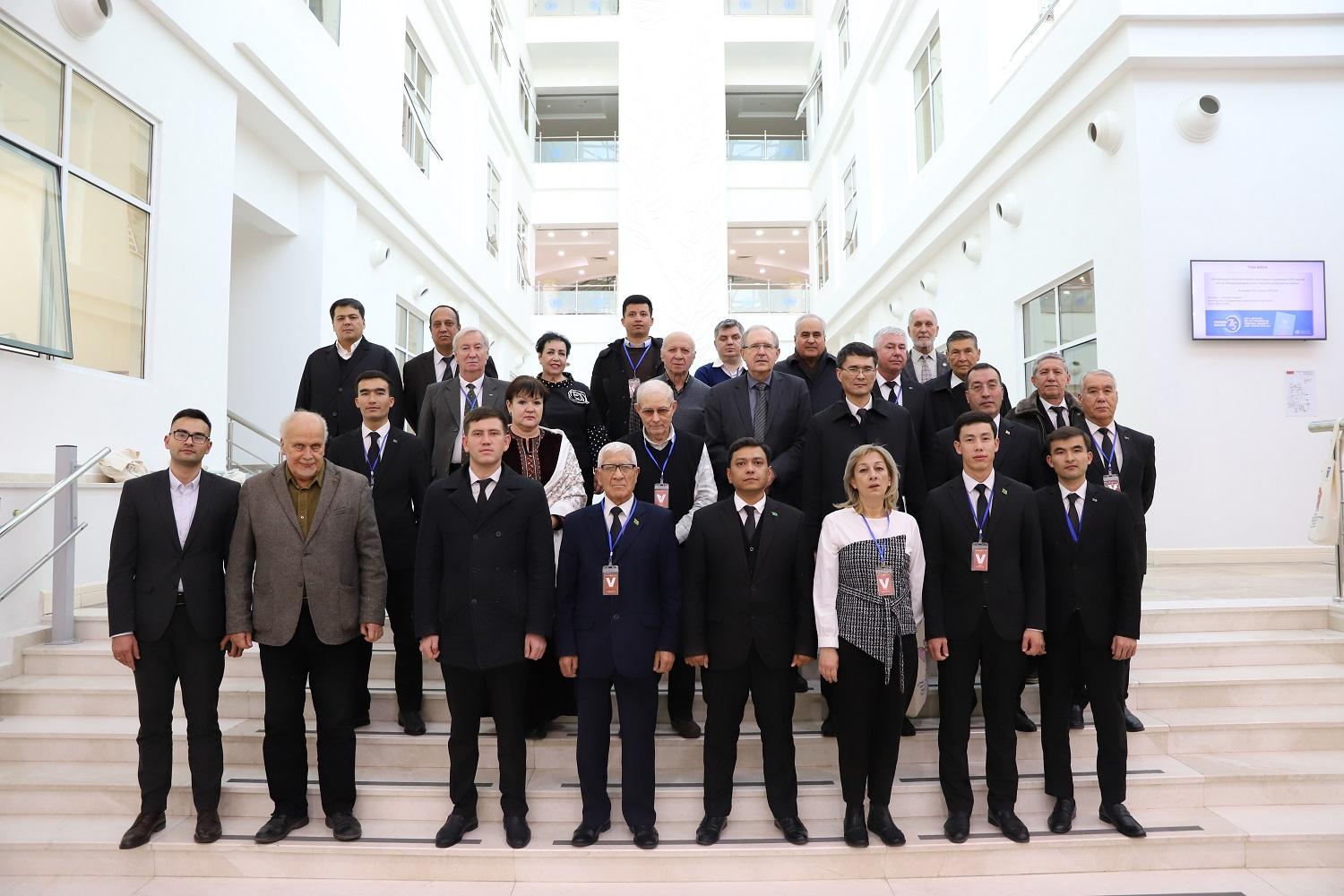 a group of people standing in front of a crowd posing for the camera