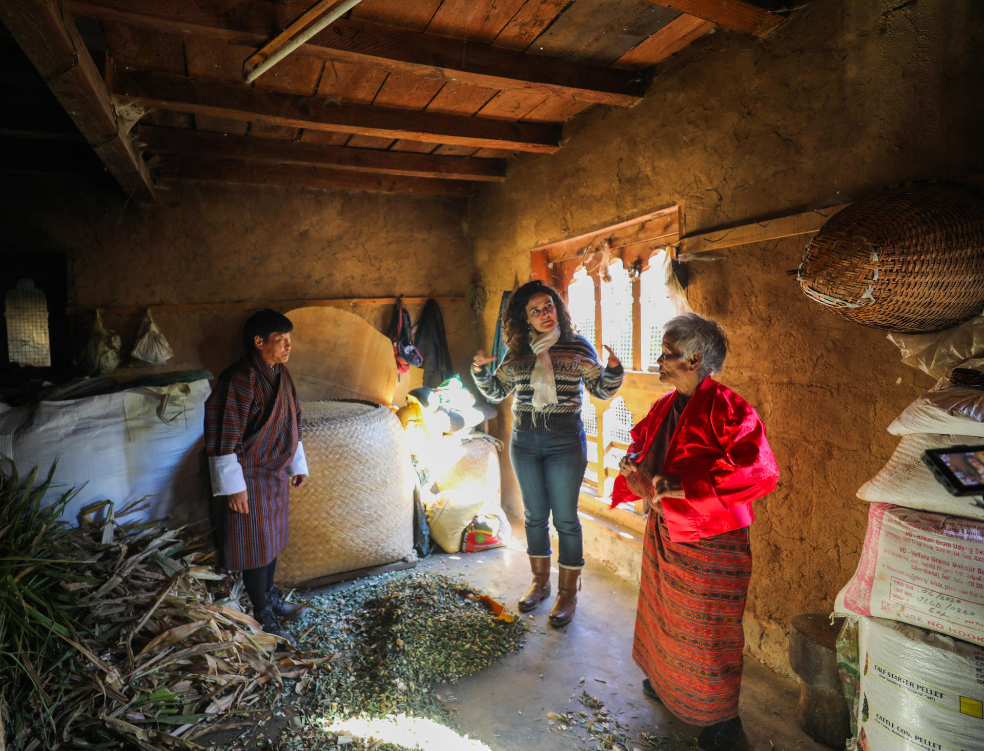 a group of people standing in a kitchen