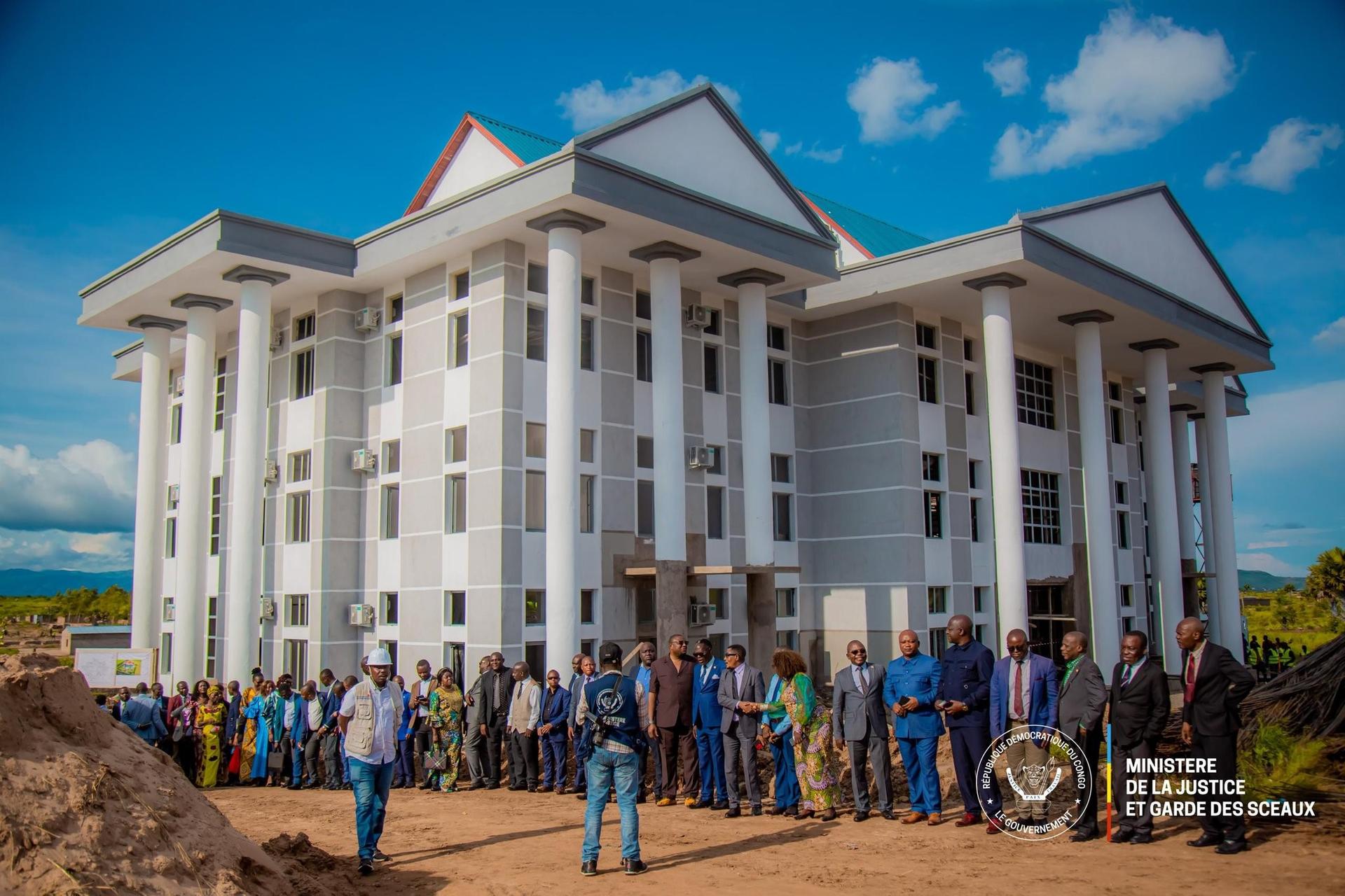 a group of people standing in front of a building