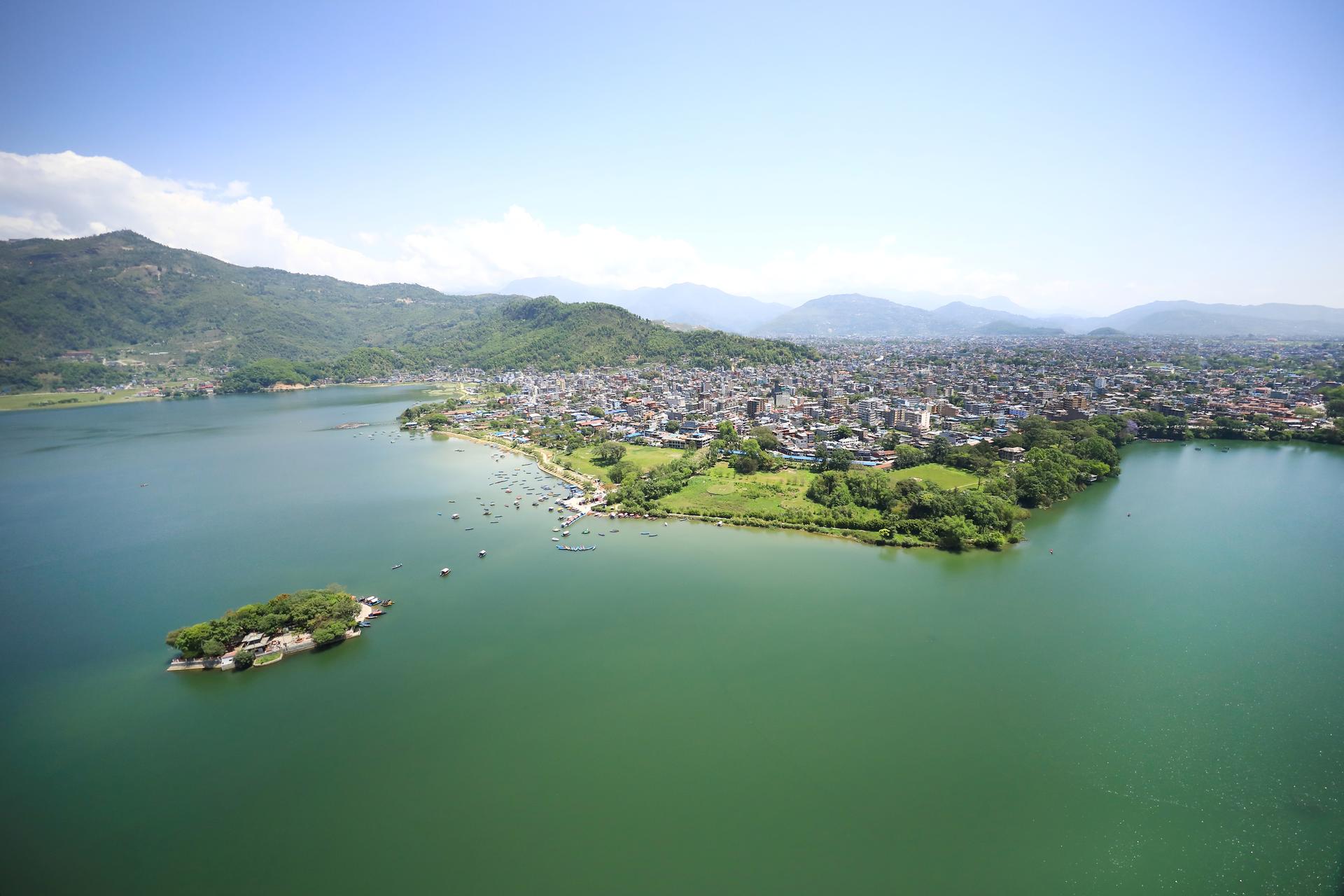 a picture of a lake with a mountain in the background