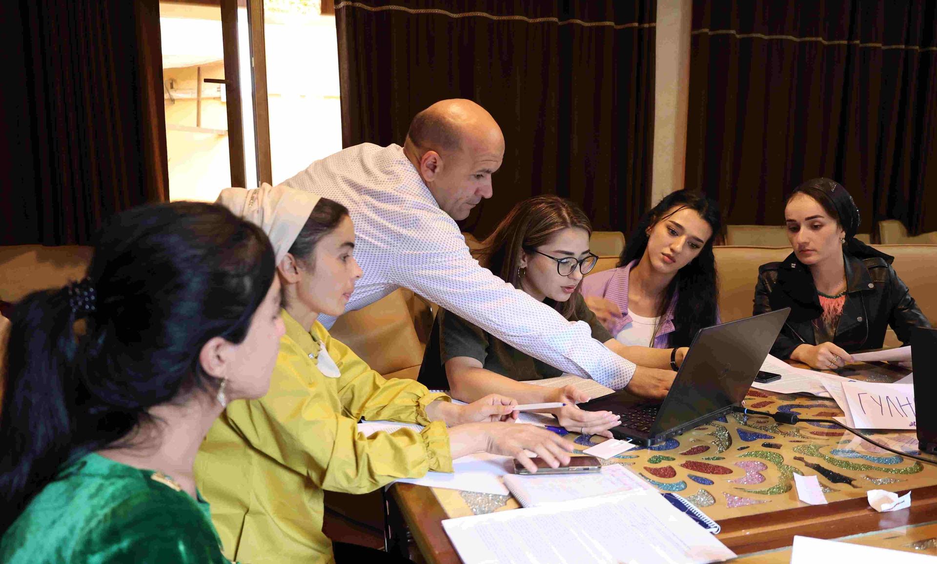 a group of people sitting at a table
