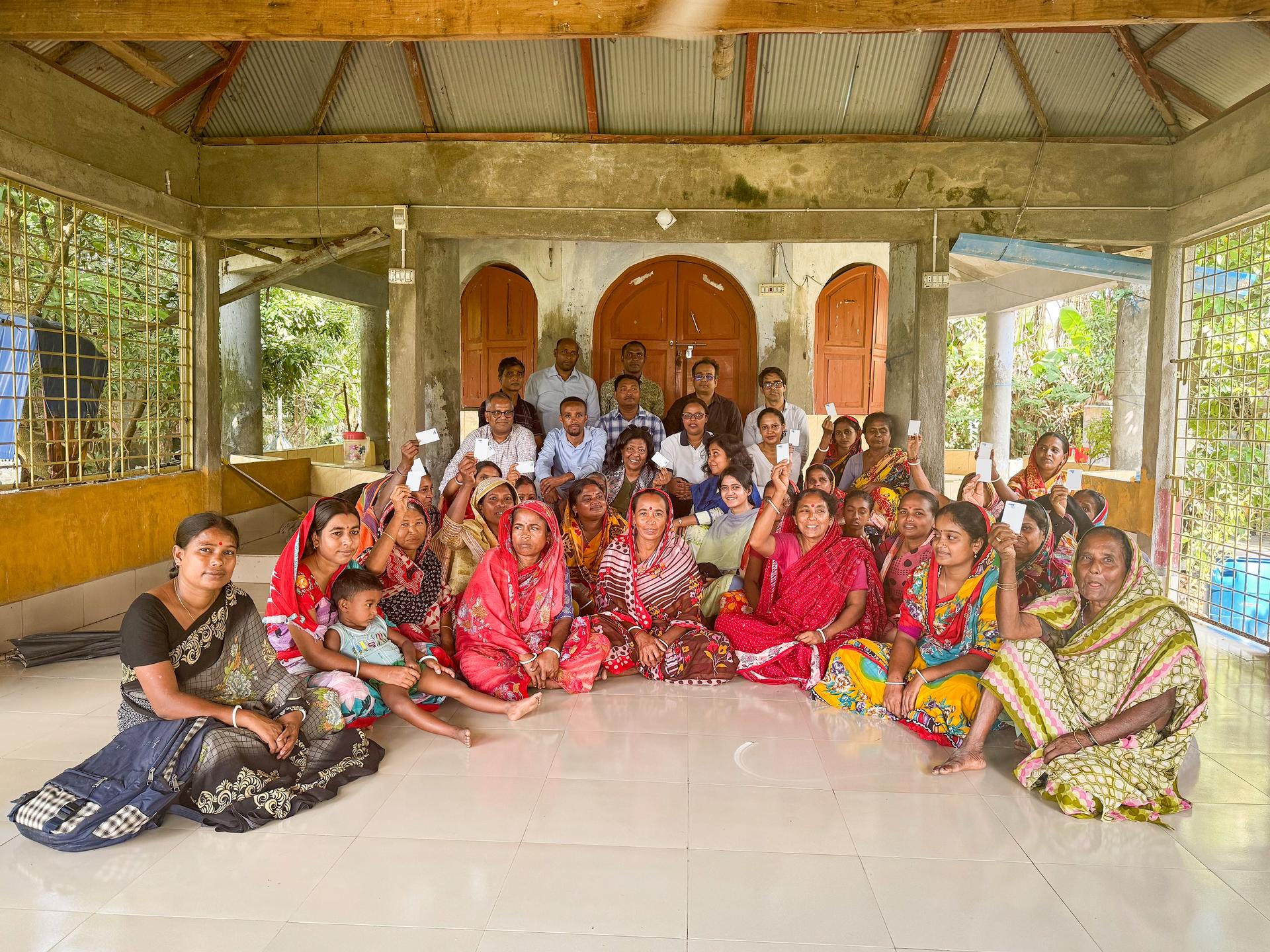 a group of people sitting posing for the camera