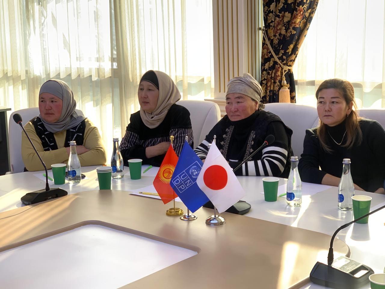 a group of women sitting at a table