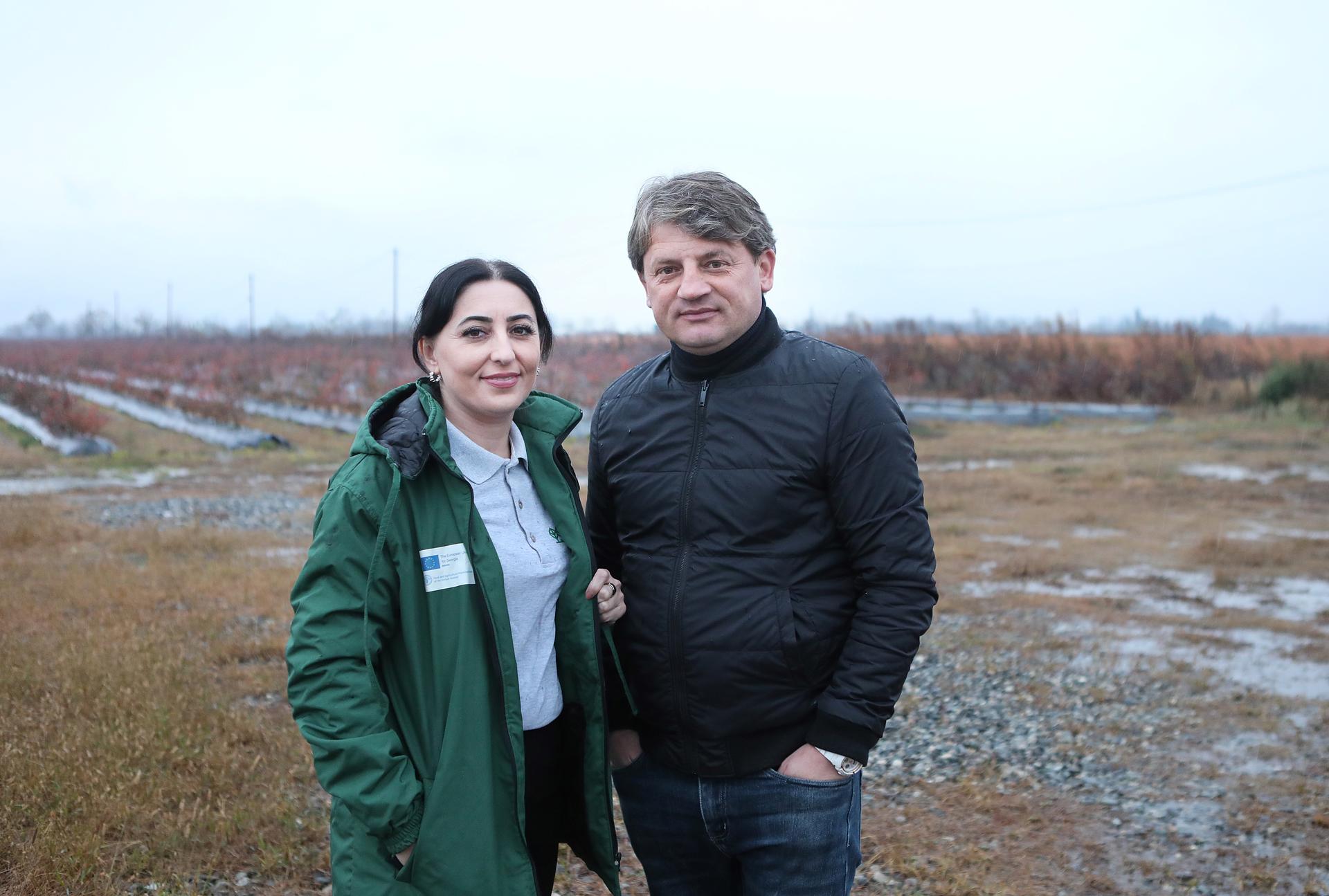 Iana Emukhvari, extensionist, and Alex Antoniuk, farmer