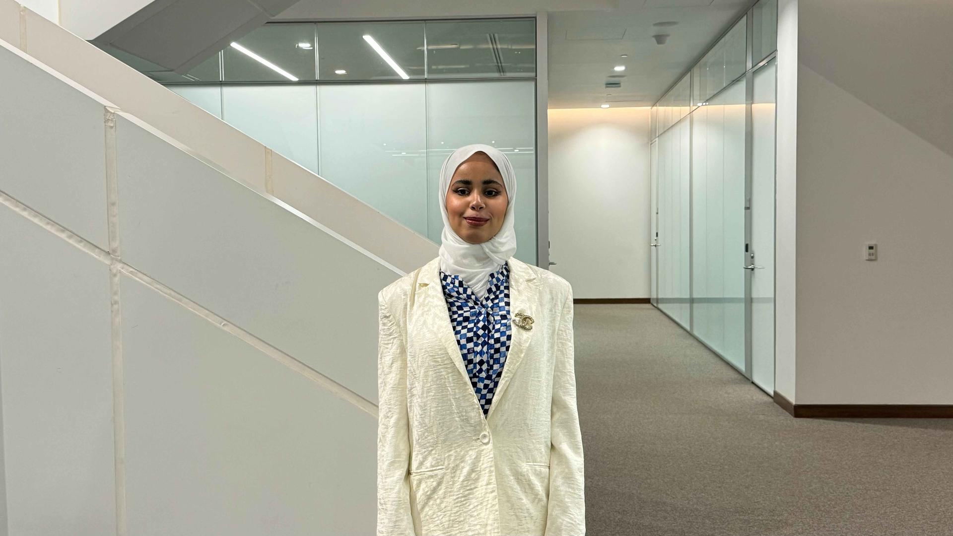 a person standing in front of a mirror posing for the camera