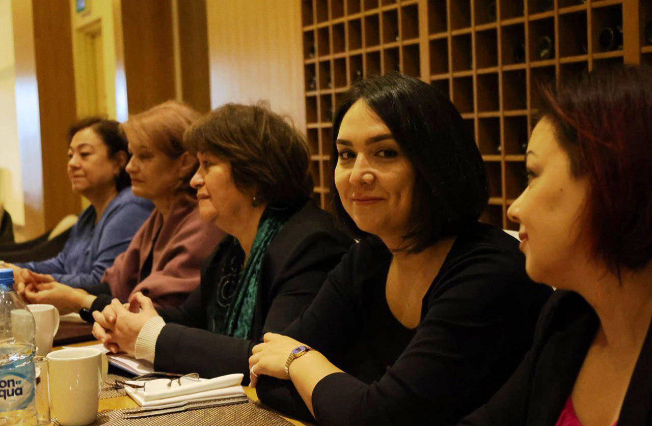a group of people sitting at a table