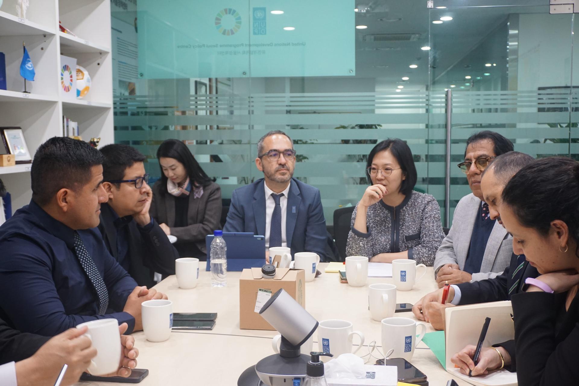 a group of people sitting at a table
