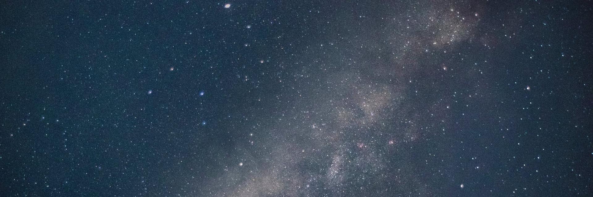 Starry night sky showcasing the Milky Way and numerous distant stars.