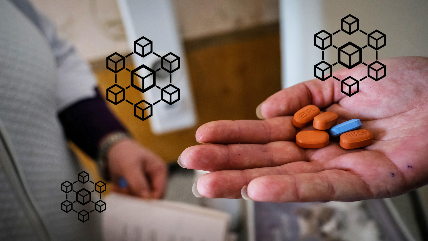 A hand holds orange and blue pills with blockchain graphics in the background.