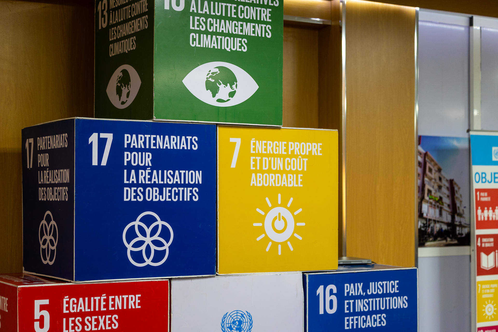 Colorful display of blocks representing sustainable development goals in a conference setting.