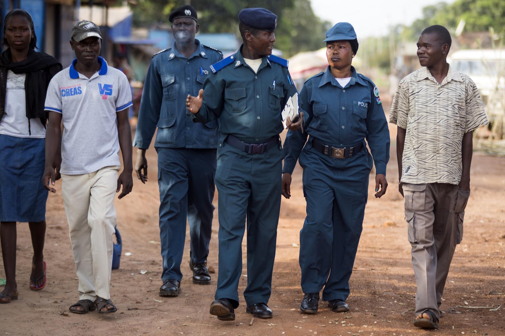 A group of people walking together, side by side