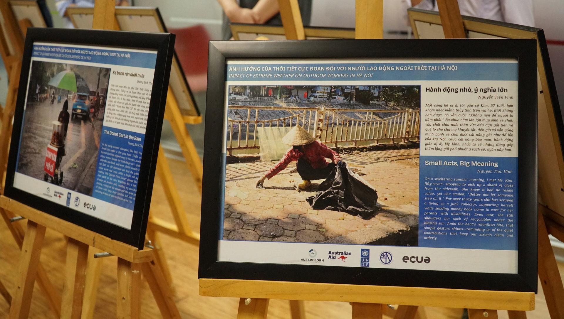 Two framed information panels on wooden easels in an exhibit, featuring photos and text.