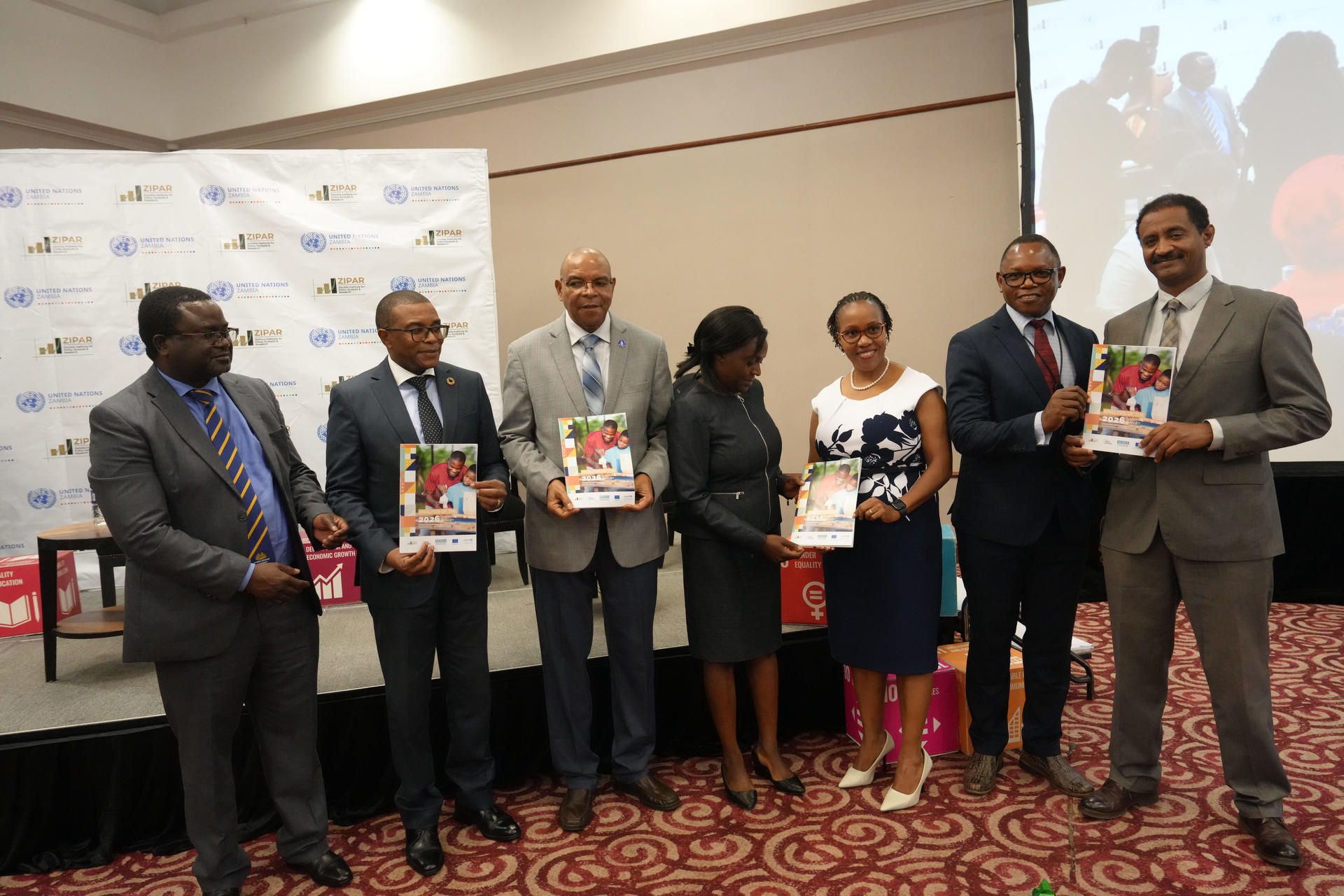 An image of James Wakiaga and other stakeholder posing for a group photoeting 