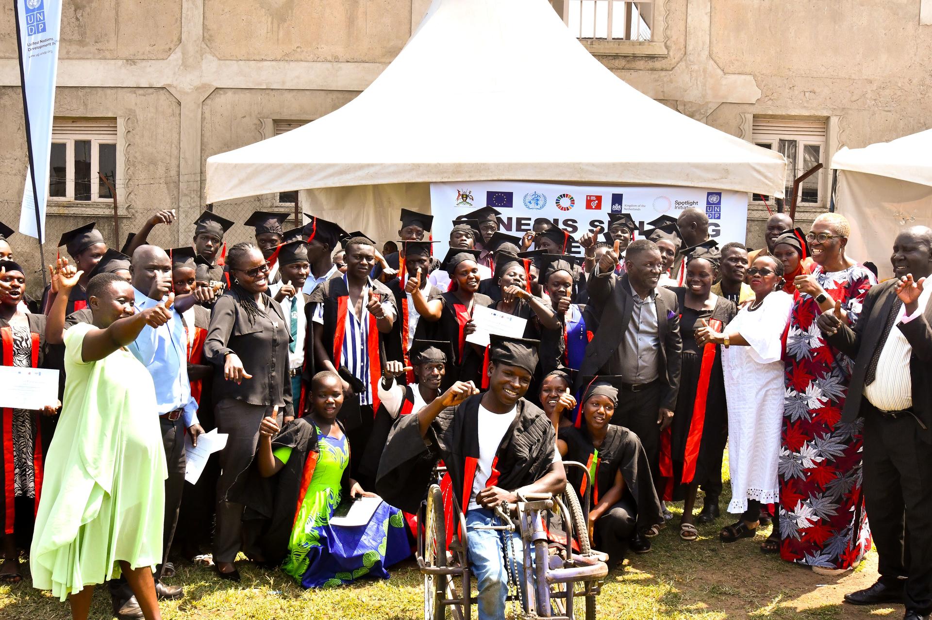 Government officials and key stake holders have a group photo with graduates 